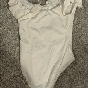 New with tags white Trina Turk ruffle one piece swimsuit.  Size 14.
